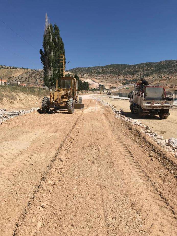 Motor grader working a freshly laid road sub-base, Lebanon.